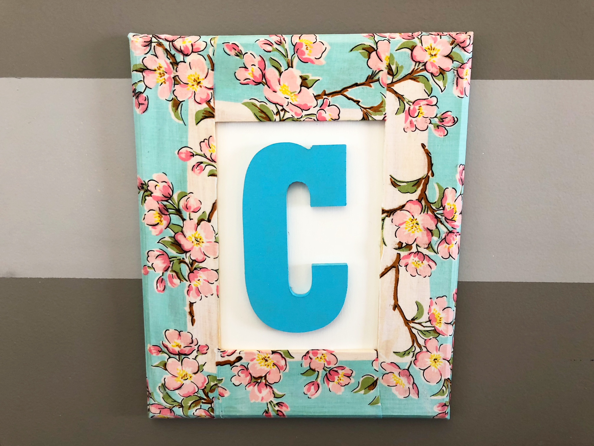 Hand made picture frame. Used old bible pages with Hodge podge glue. Made  flower with hot glue and fabric wit…