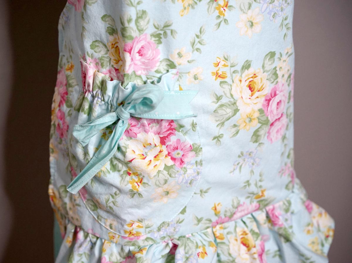 Pastel Blue Floral Apron with Double Ruffle Skirt & Bow Accent