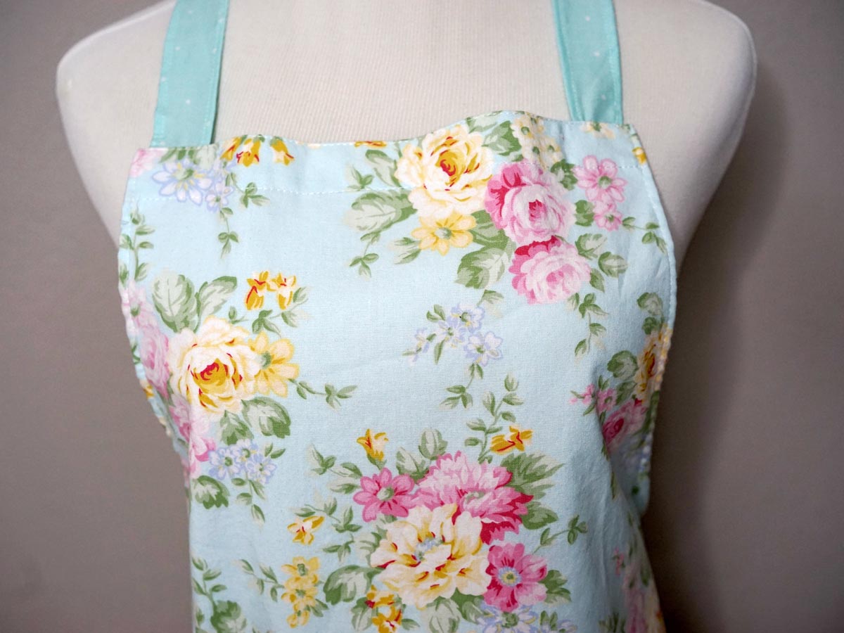 Pastel Blue Floral Apron with Double Ruffle Skirt & Bow Accent