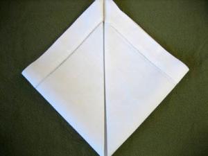 Folding a Napkin Into a Rosebud